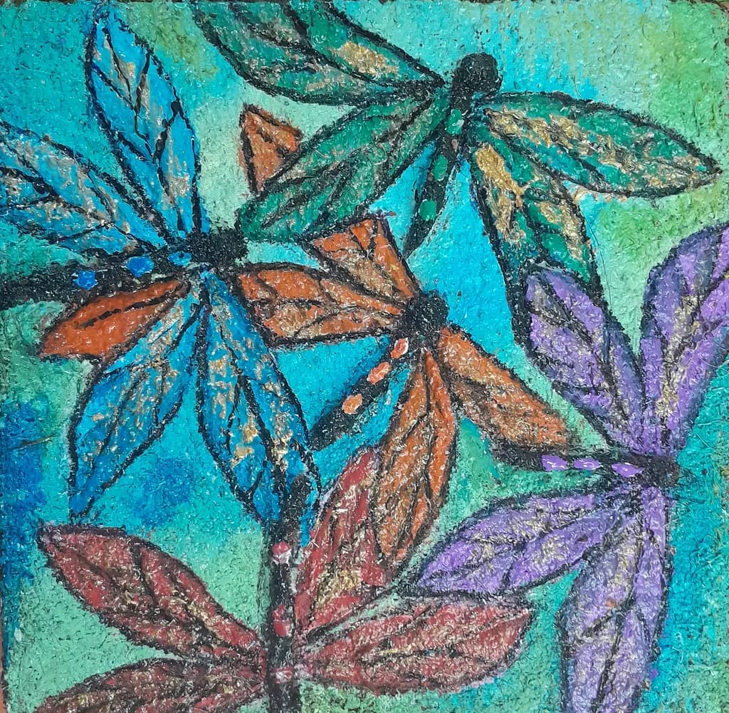 Whimsical Dance of Colorful Dragonflies on Vibrant Blue Canvas