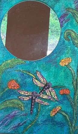 Whimsical Reflections: A Dragonfly Garden Mirror in Vibrant Hues