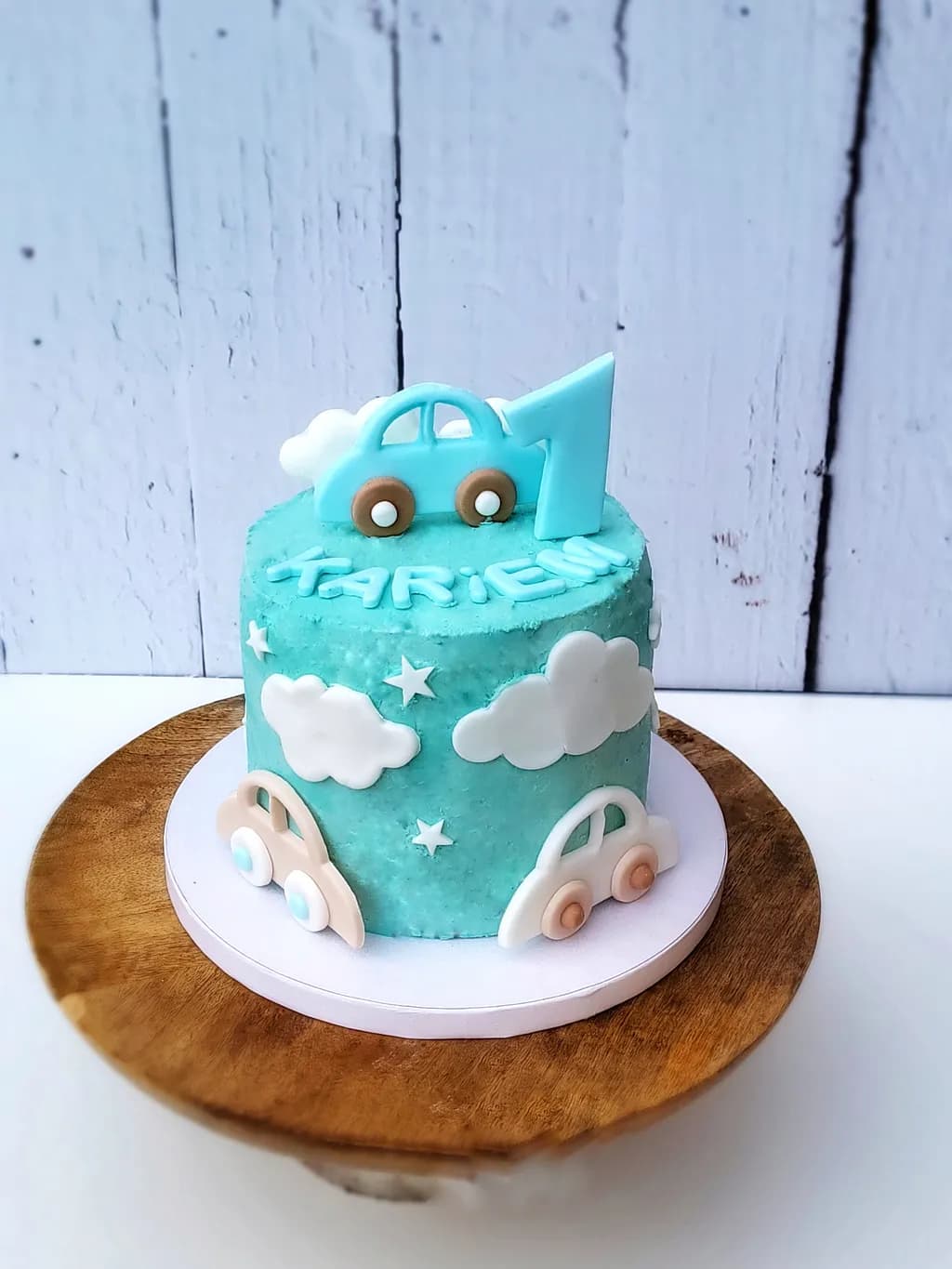 Whimsical Blue Car Cake for a First Birthday Celebration