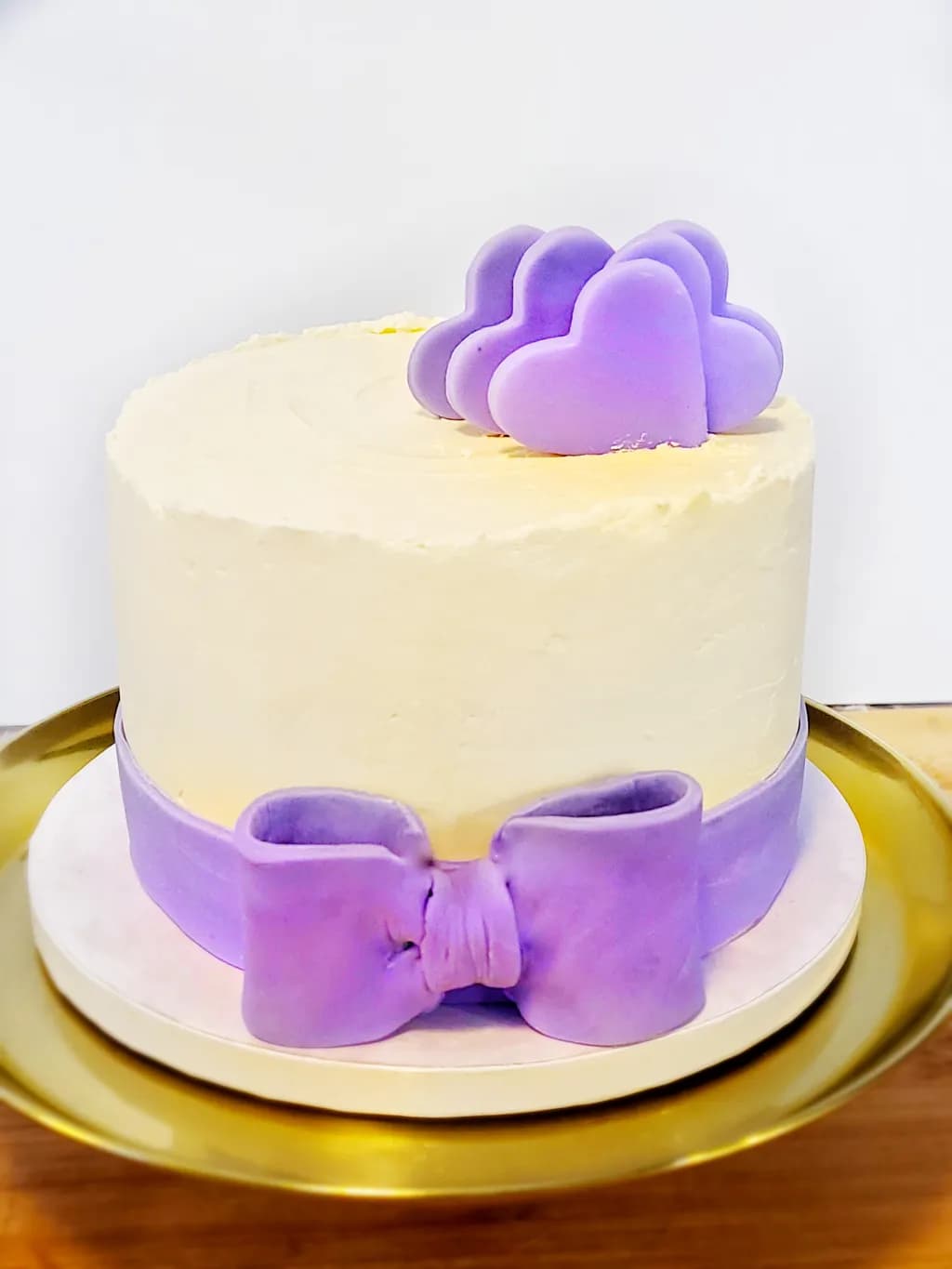 Whimsical Lavender Heart Cake with Elegant Bow Decoration