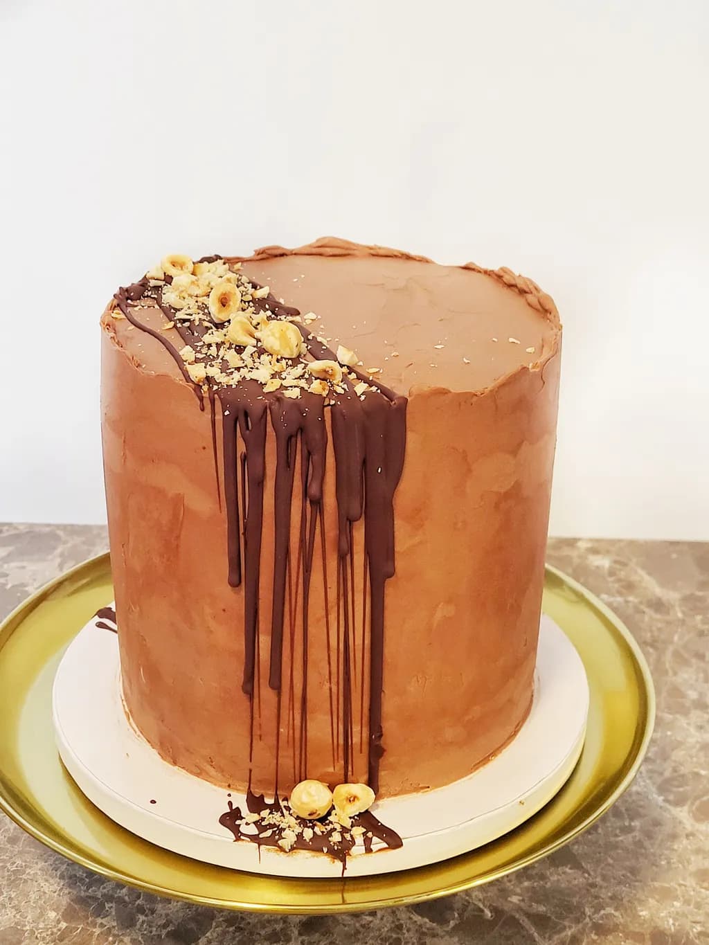 Decadent Chocolate Hazelnut Cake with Dripping Ganache and Crunchy Toppings