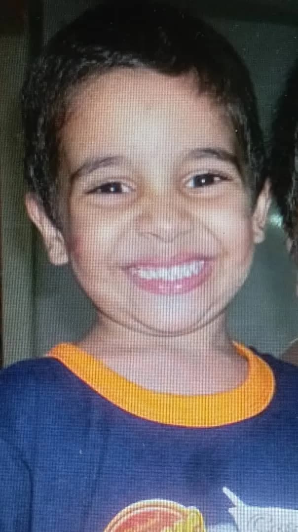Joyful Innocence: A Child's Playful Smile Captured in Time