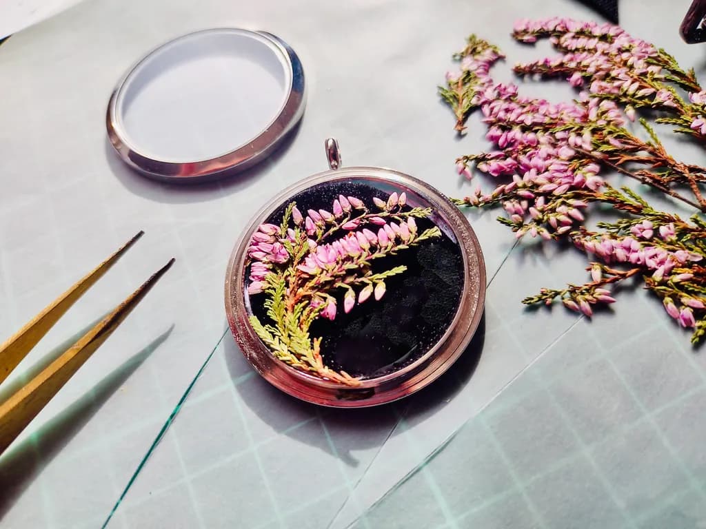 Ethereal Blooms: Preserved Pink Heather in a Silver Pendant