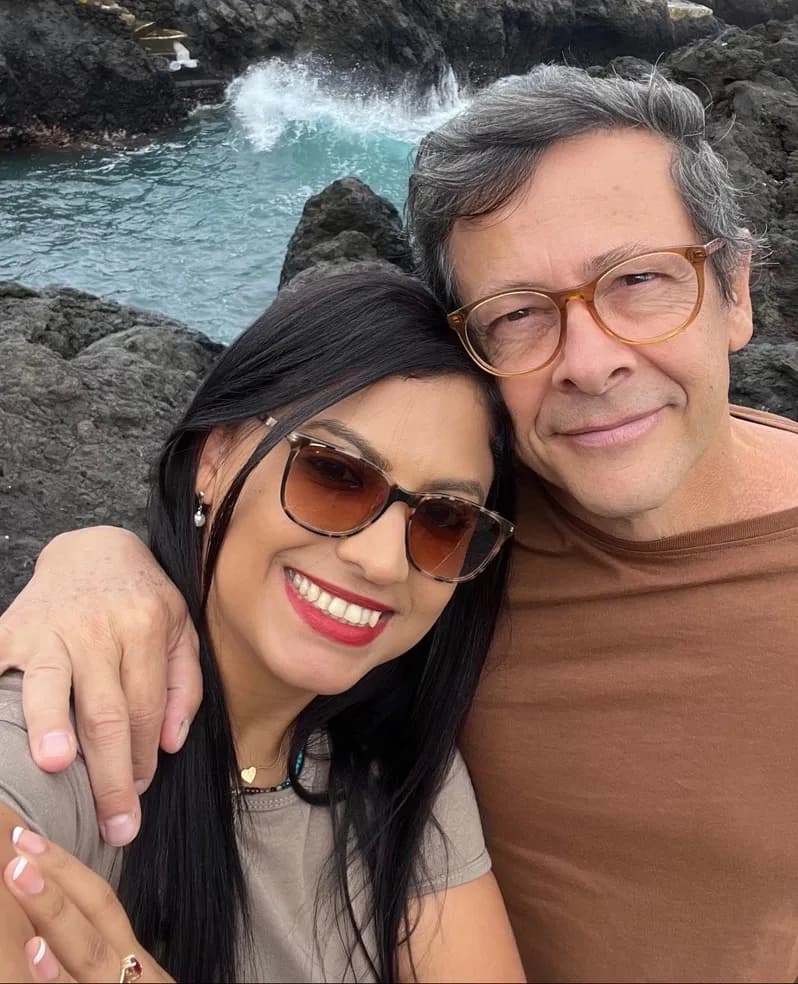 Eternal Moments: A Joyful Embrace by the Ocean's Edge