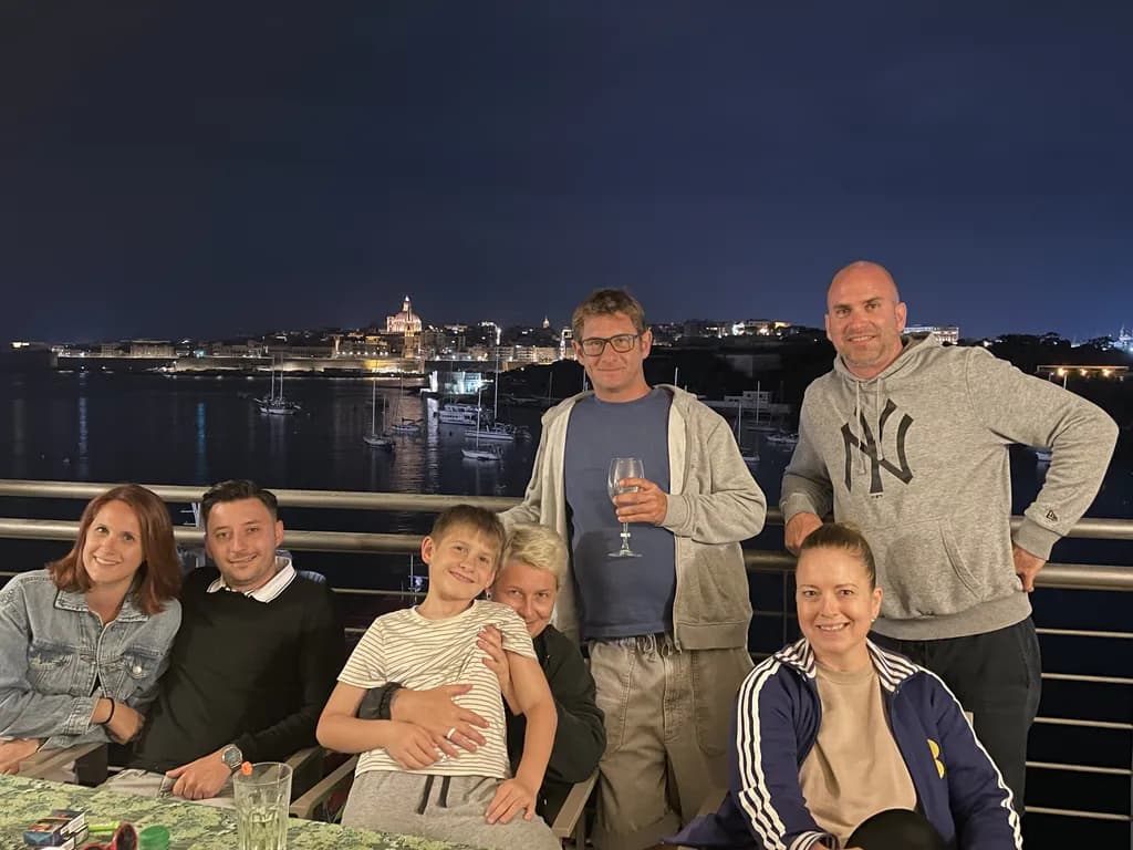 Evening Together: A Family Gathering by the Waterfront at Night