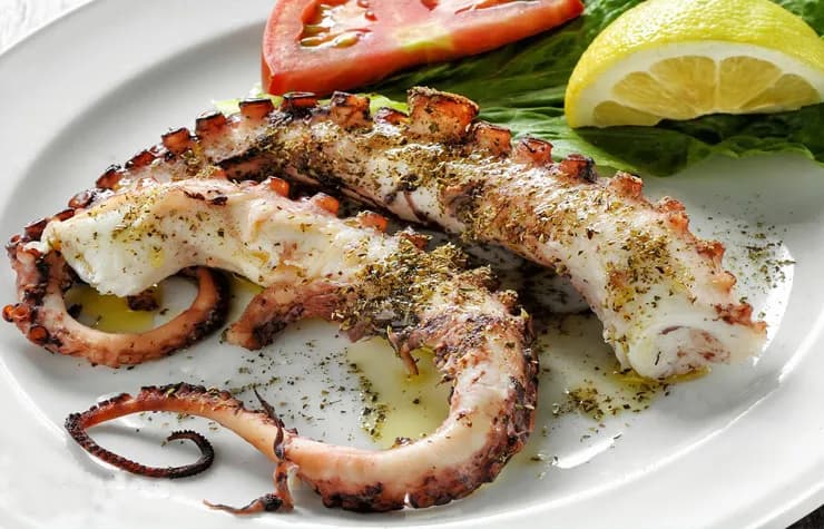 Savory Octopus Delight: A Culinary Masterpiece with Fresh Herbs and Citrus Accents