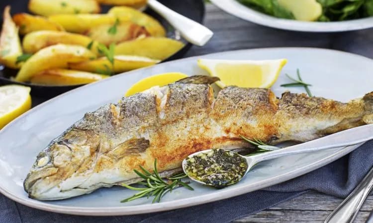 Crispy Herb-Infused Grilled Trout with Lemon and Garlic Potatoes: A Culinary Delight