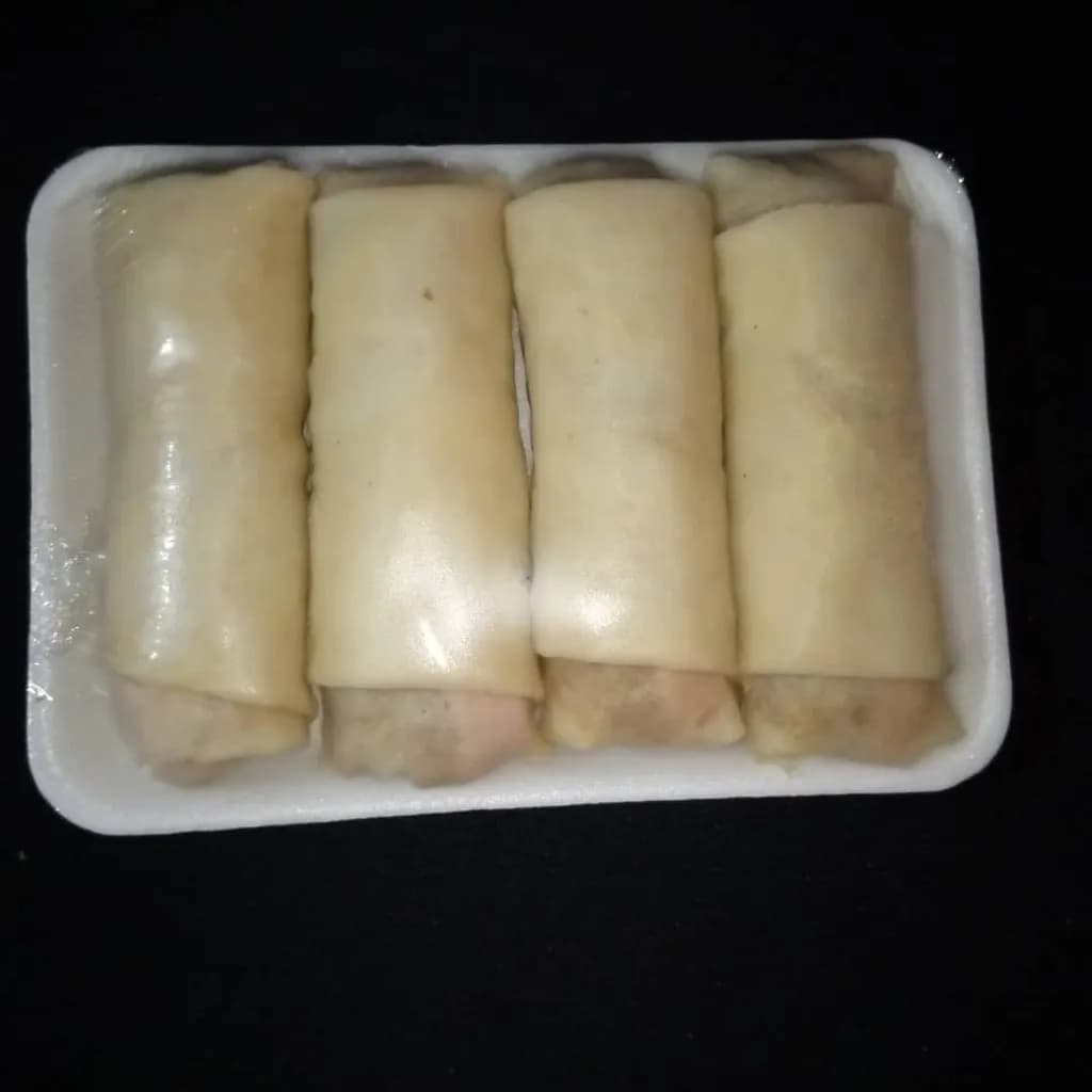 Savory Delights: A Platter of Four Exquisite Spring Rolls Wrapped in Perfection