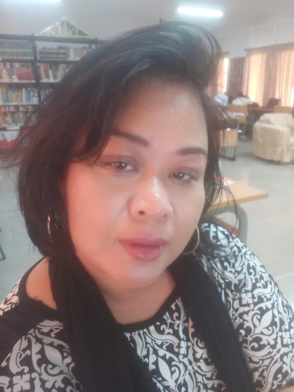 Whispers of Knowledge: A Portrait in the Library's Embrace