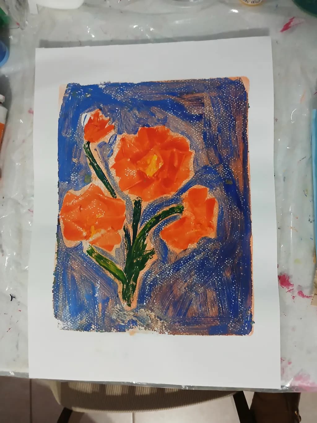 Vibrant Blossoms: A Dance of Orange Flowers Against a Deep Blue Canvas