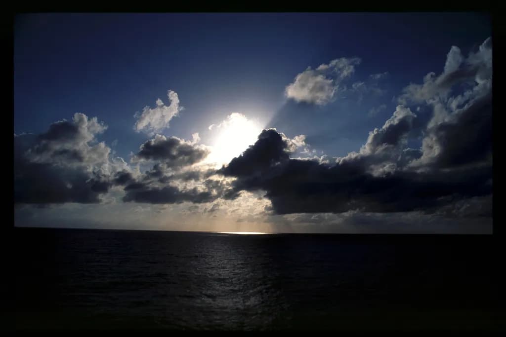 Ethereal Horizon: A Dance of Light and Clouds at Dusk
