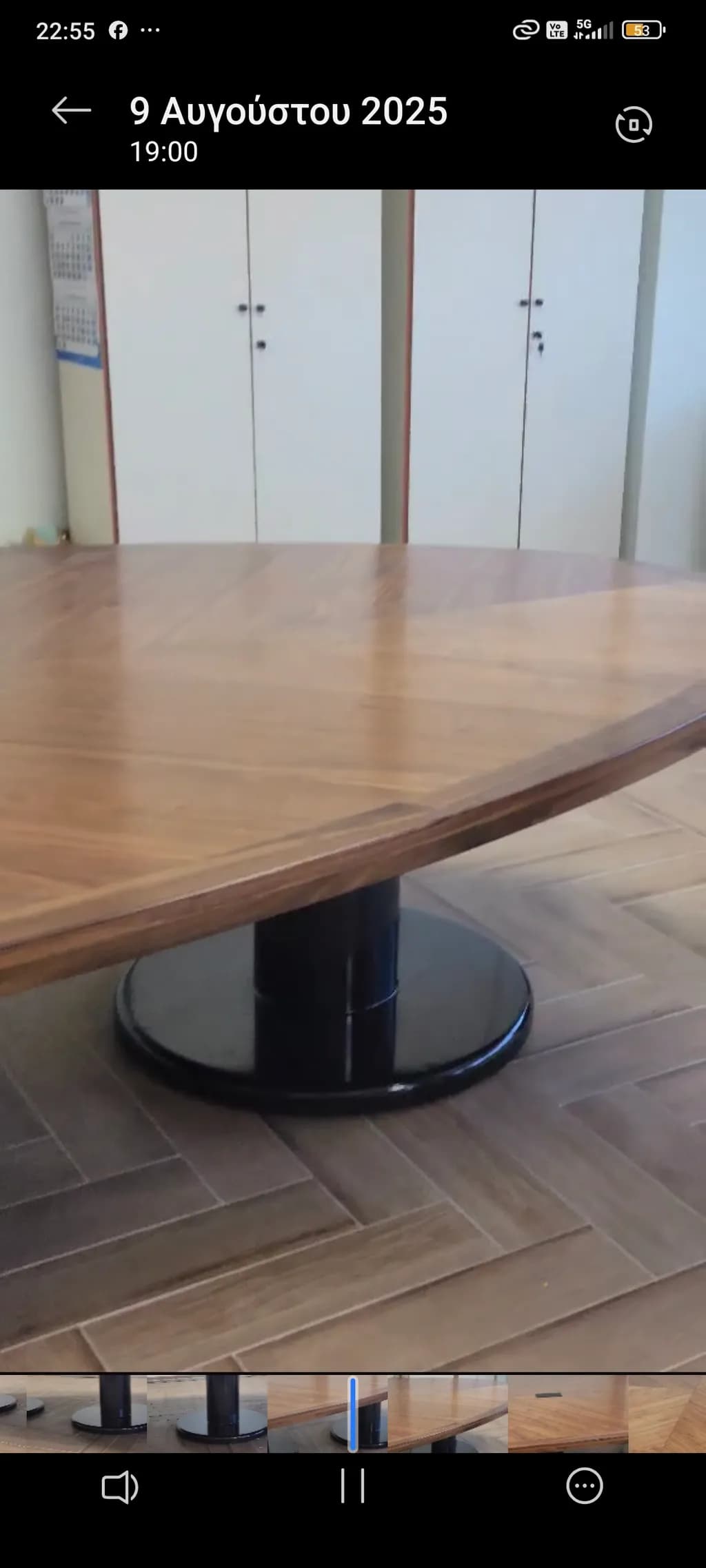Elegant Round Wooden Table with Sleek Black Base for Modern Interiors