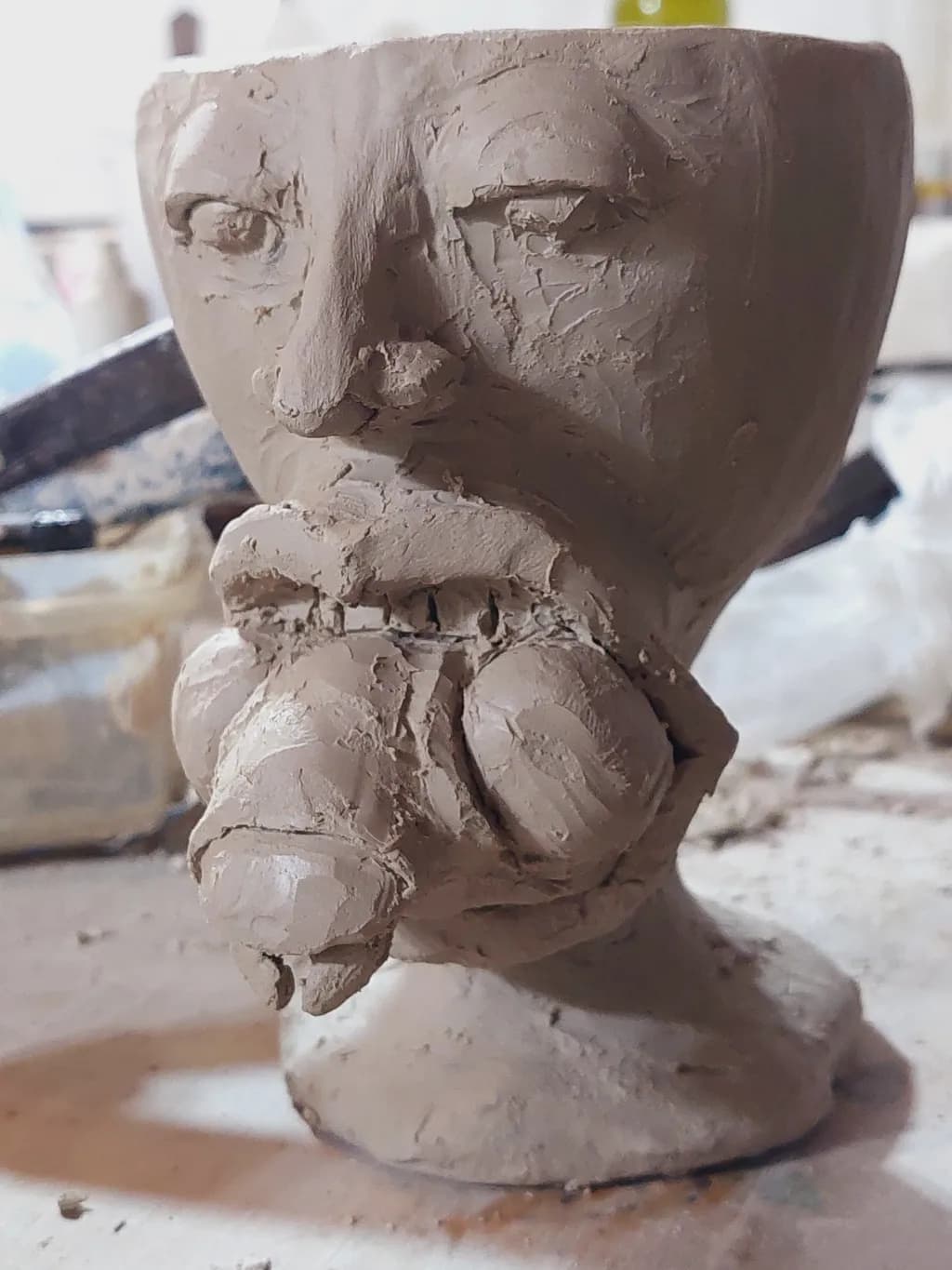 Whimsical Clay Face: A Playful Exploration of Form and Expression