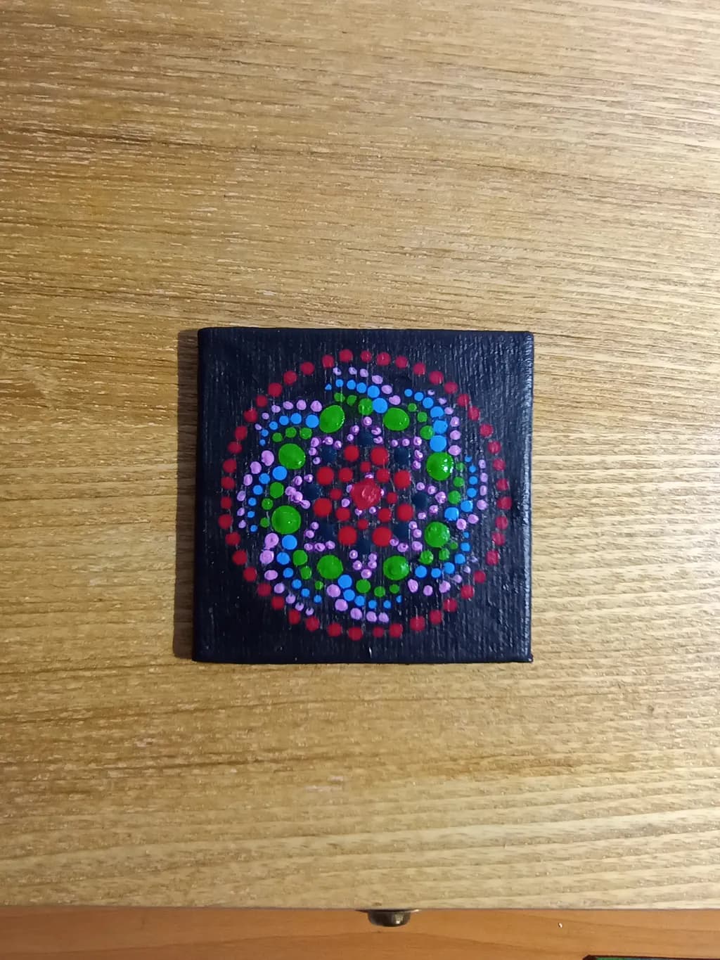 Vibrant Harmony: A Dot Mandala on Black Canvas