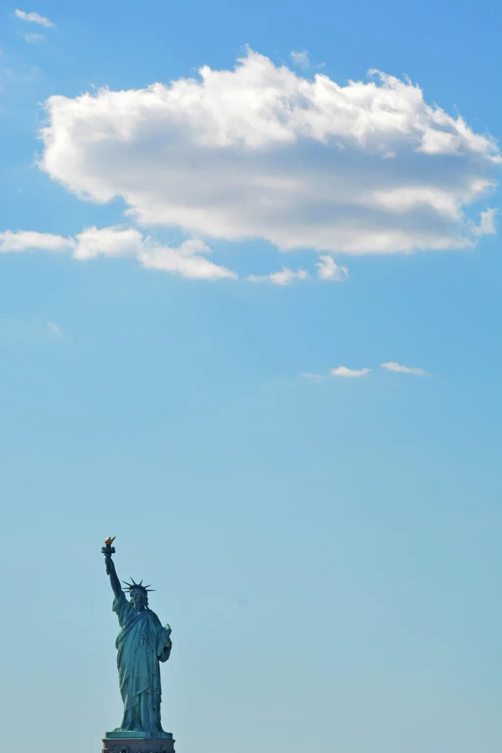 Whispers of Freedom: The Statue of Liberty Beneath a Dreamy Sky