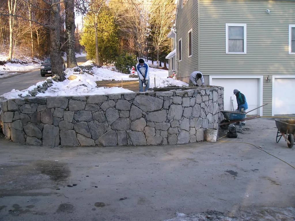 Crafting Community: The Art of Stonework in Winter's Embrace