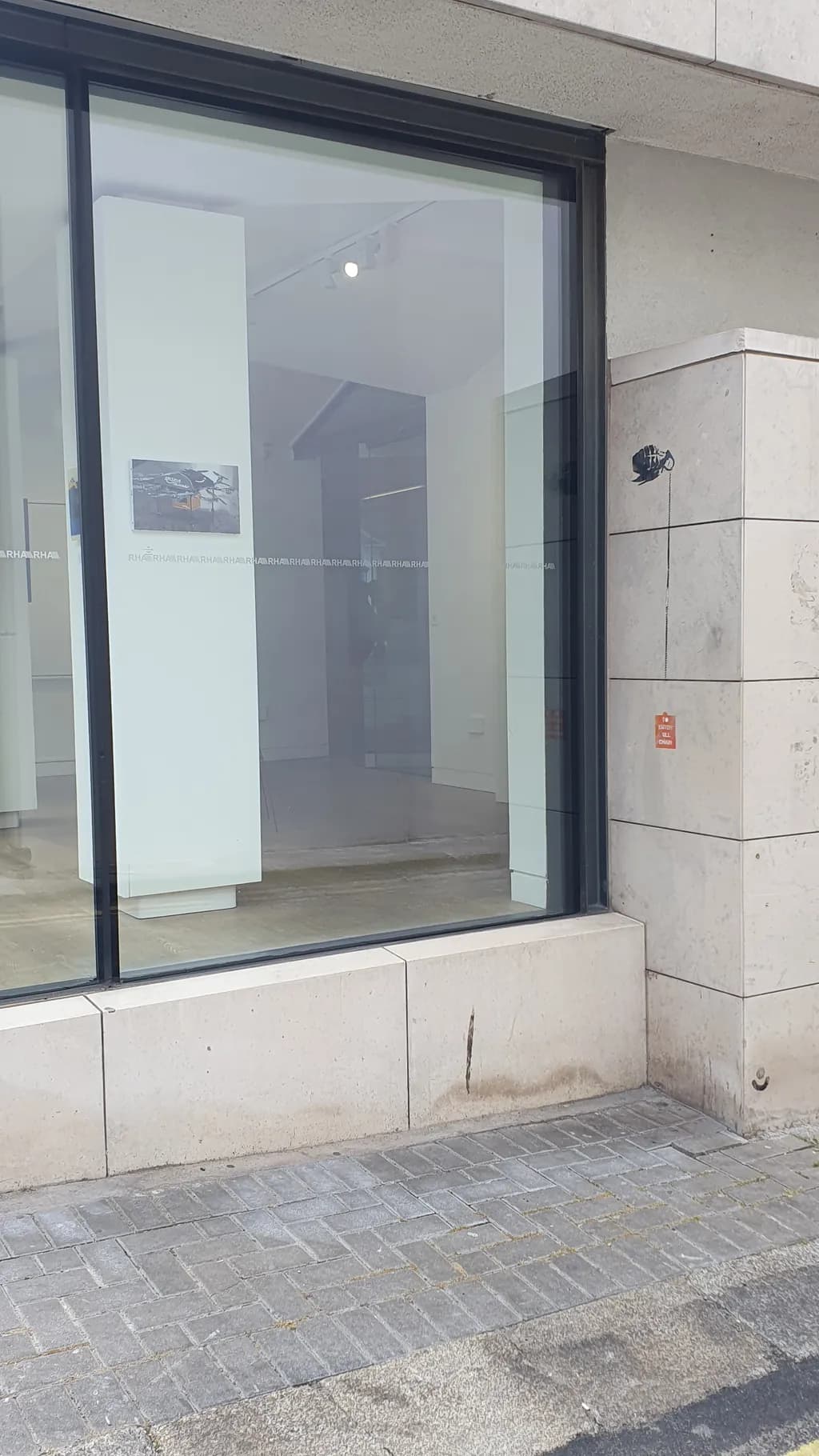Urban Reflections: A Glimpse Through the Gallery Window