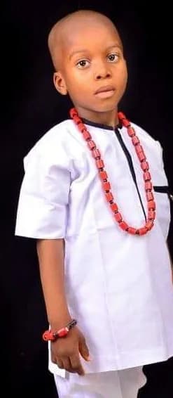 Traditional Elegance: A Portrait of Innocence in Beaded Attire