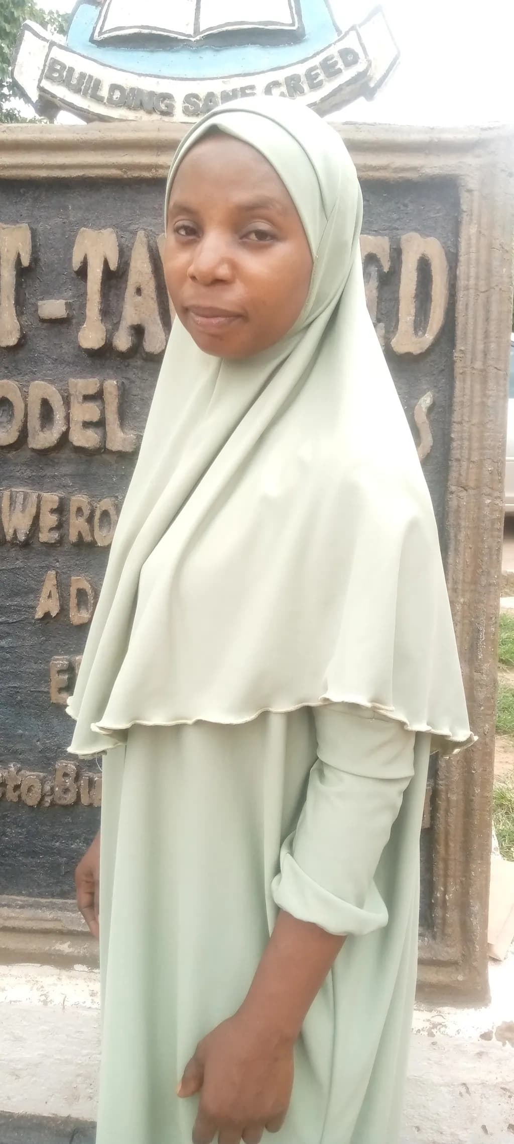 Embracing Elegance: A Portrait of Grace in Green Attire