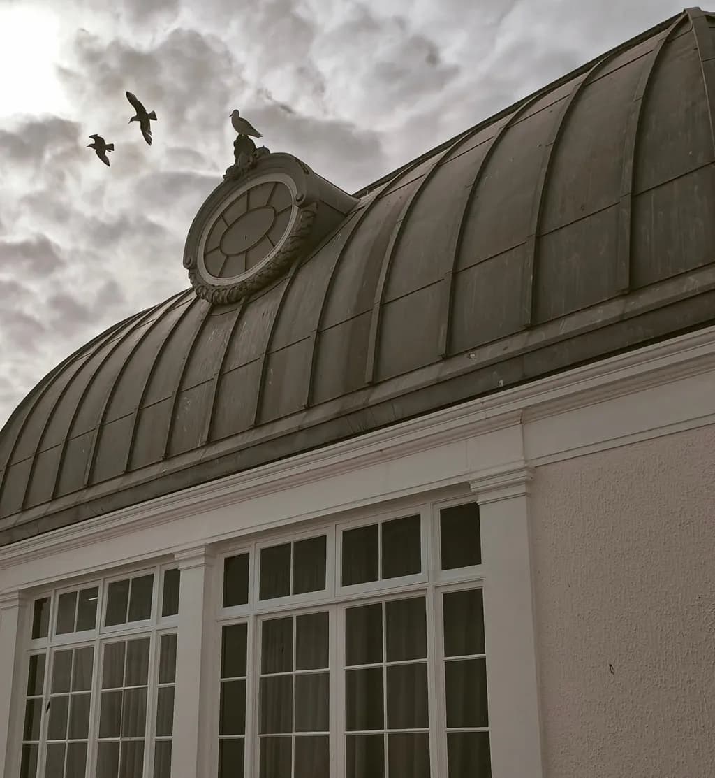 Whispers of Time: A Serene Architectural Moment Beneath the Clouds
