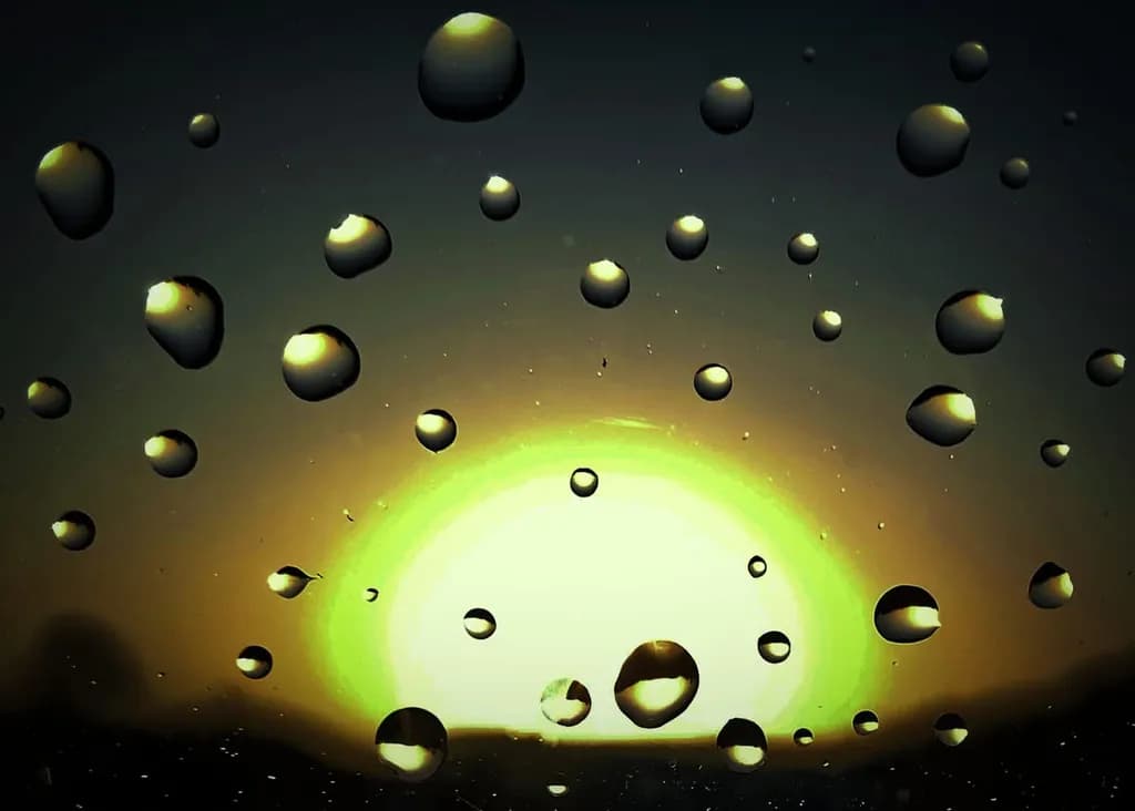 Ethereal Reflections: Raindrops Embracing the Golden Horizon