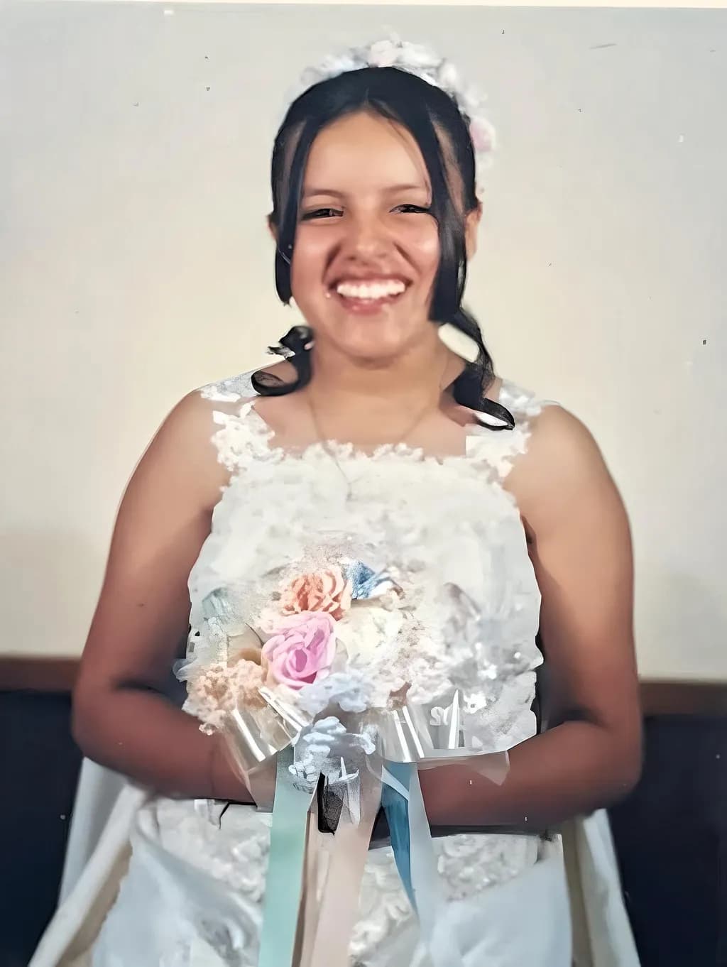 Ethereal Elegance: A Joyful Bride's Radiant Smile and Floral Embrace