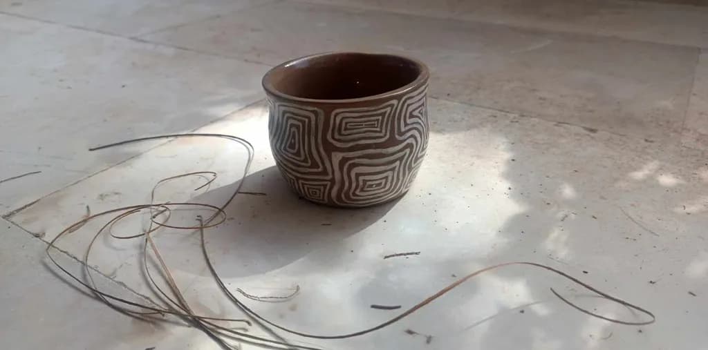 Whimsical Earth: Handcrafted Ceramic Cup with Intricate Patterns