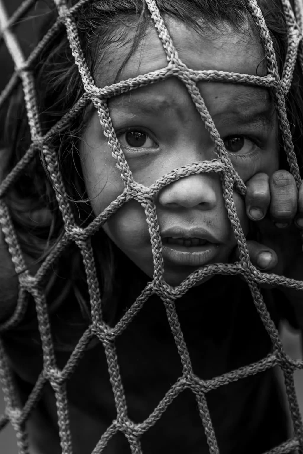Behind the Veil: A Child's Silent Plea for Freedom
