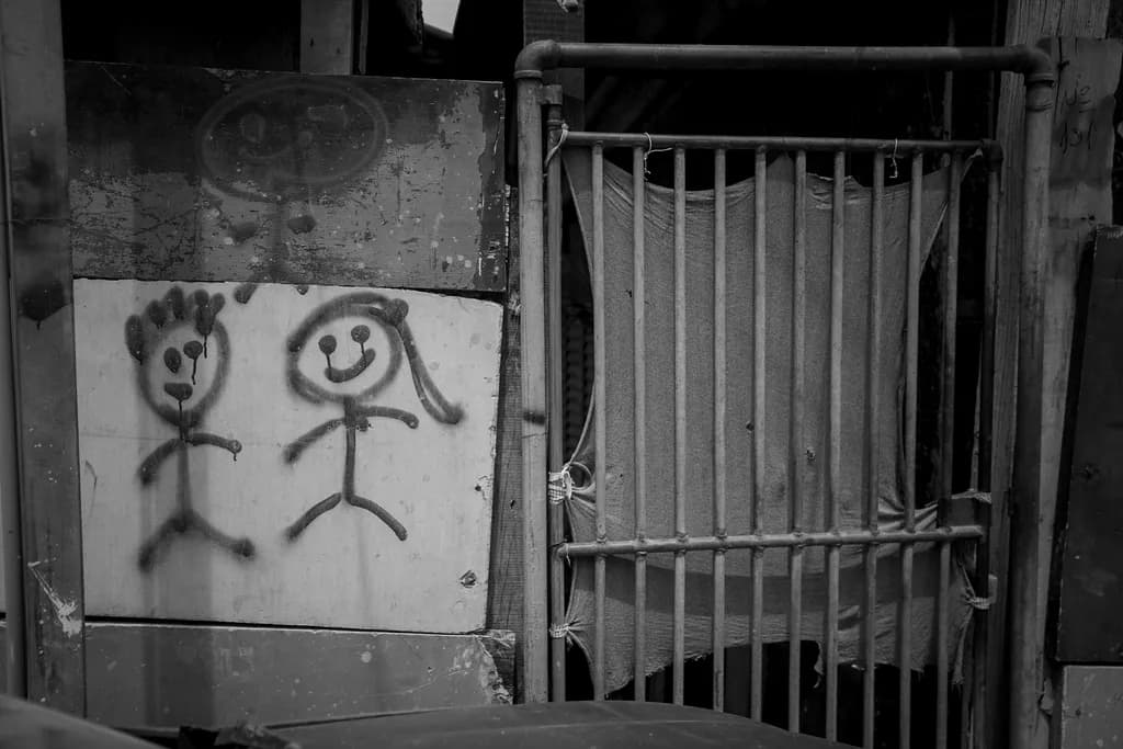 Whispers of Innocence: A Black and White Journey Through Urban Artistry