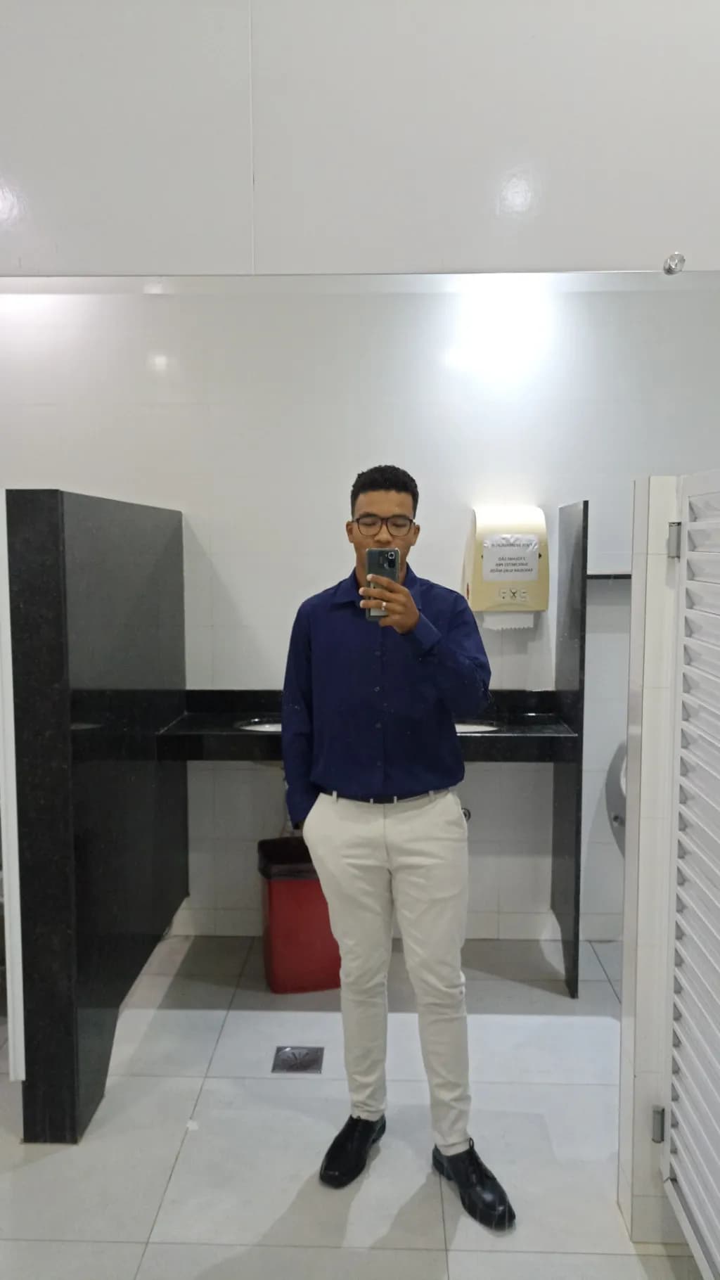 Reflections of Confidence: A Stylish Self-Portrait in a Modern Space