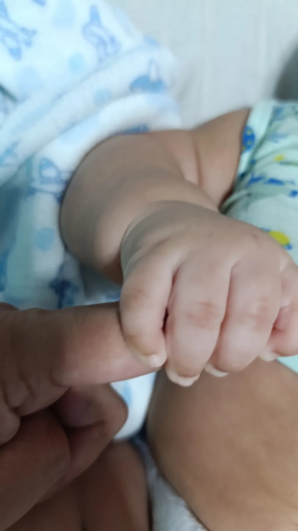 Tender Connections: A Moment of Innocence and Love Between Baby and Caregiver