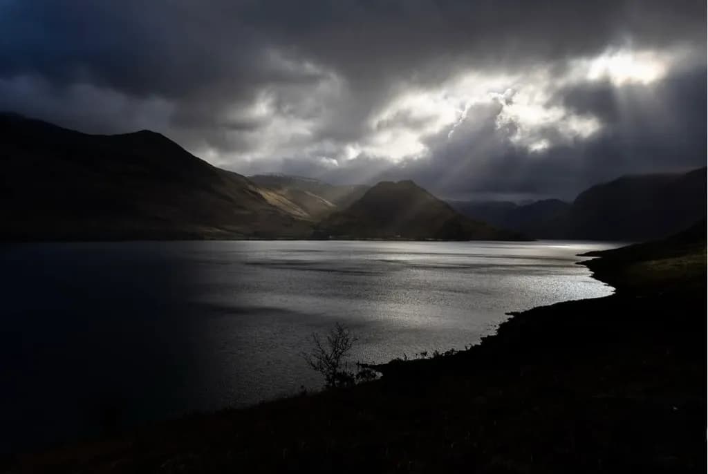 Whispers of Light: A Serene Reflection on a Dramatic Landscape