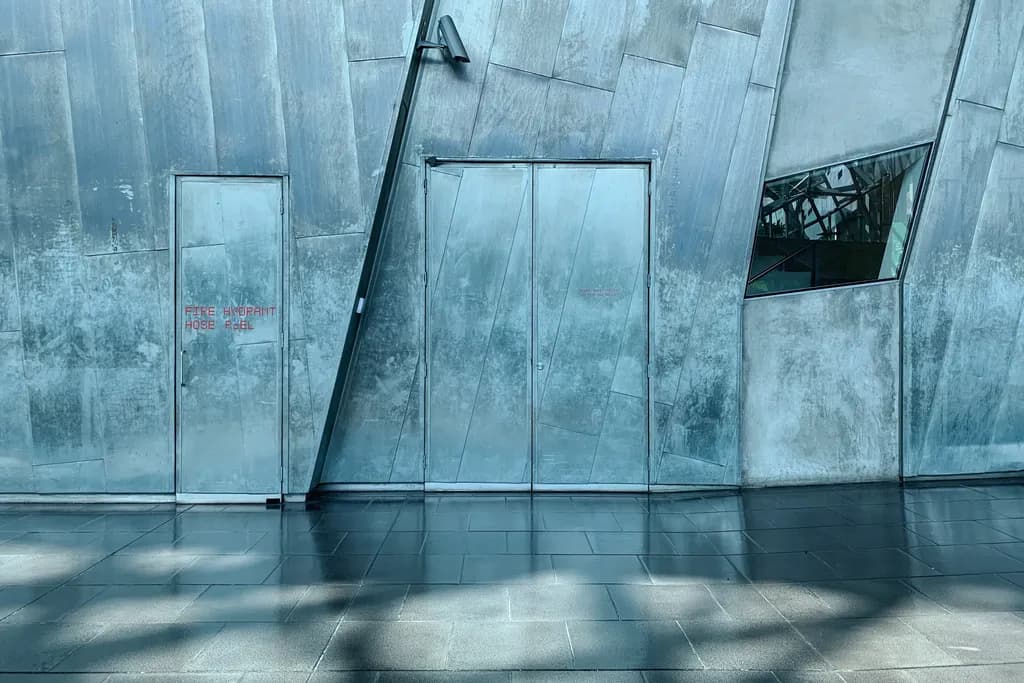 Urban Reflections: The Geometry of Steel and Shadows