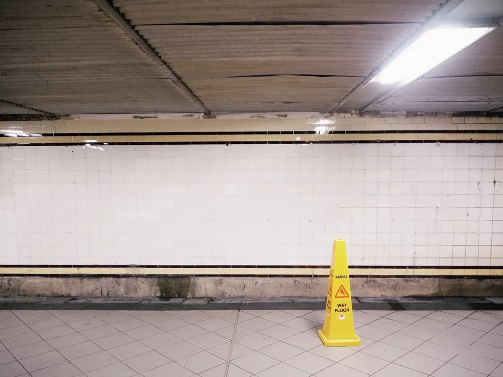 Urban Stillness: A Moment of Caution in the Subway's Emptiness
