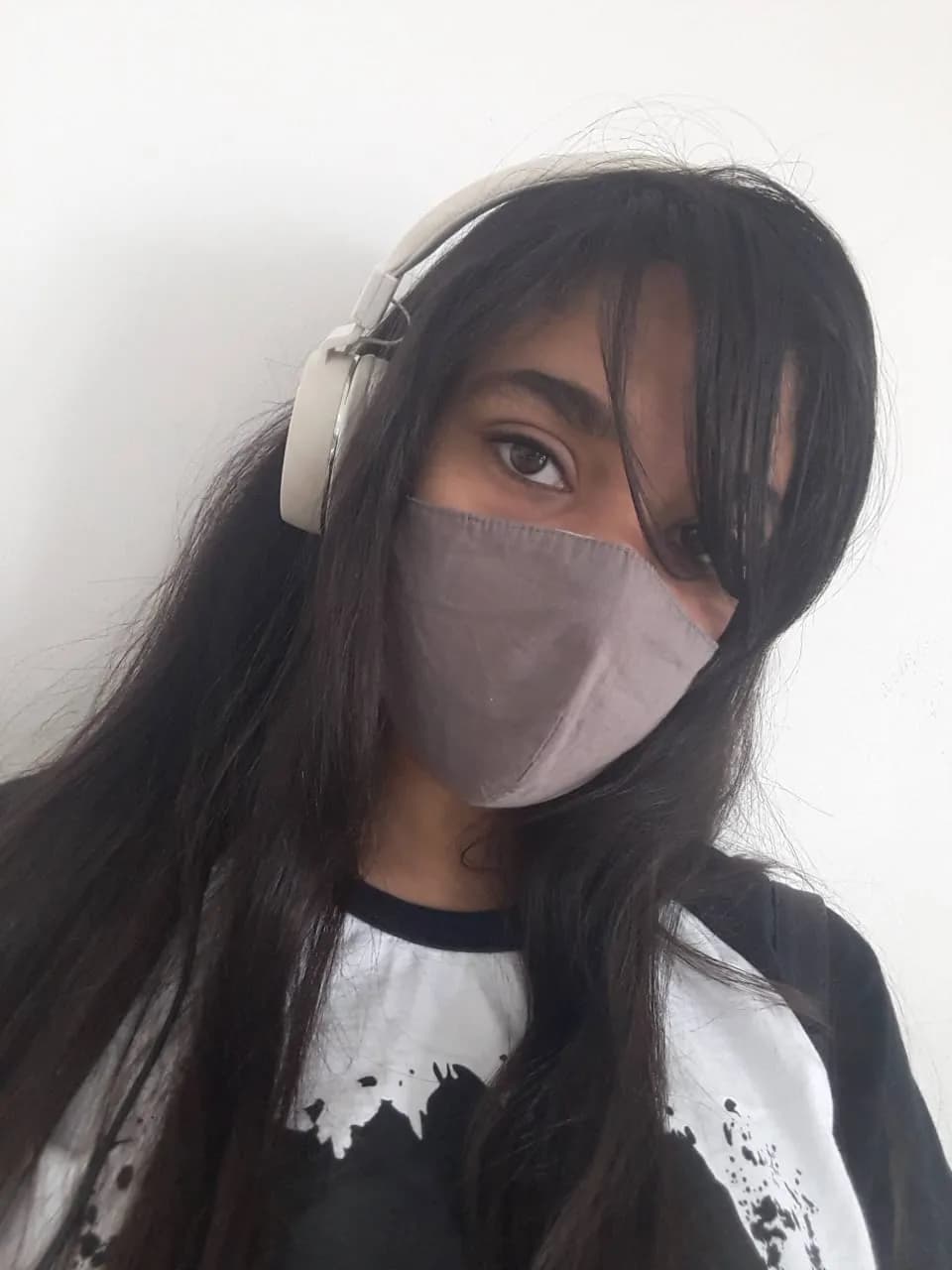 Whispers of Solitude: A Portrait of Resilience in a Masked World