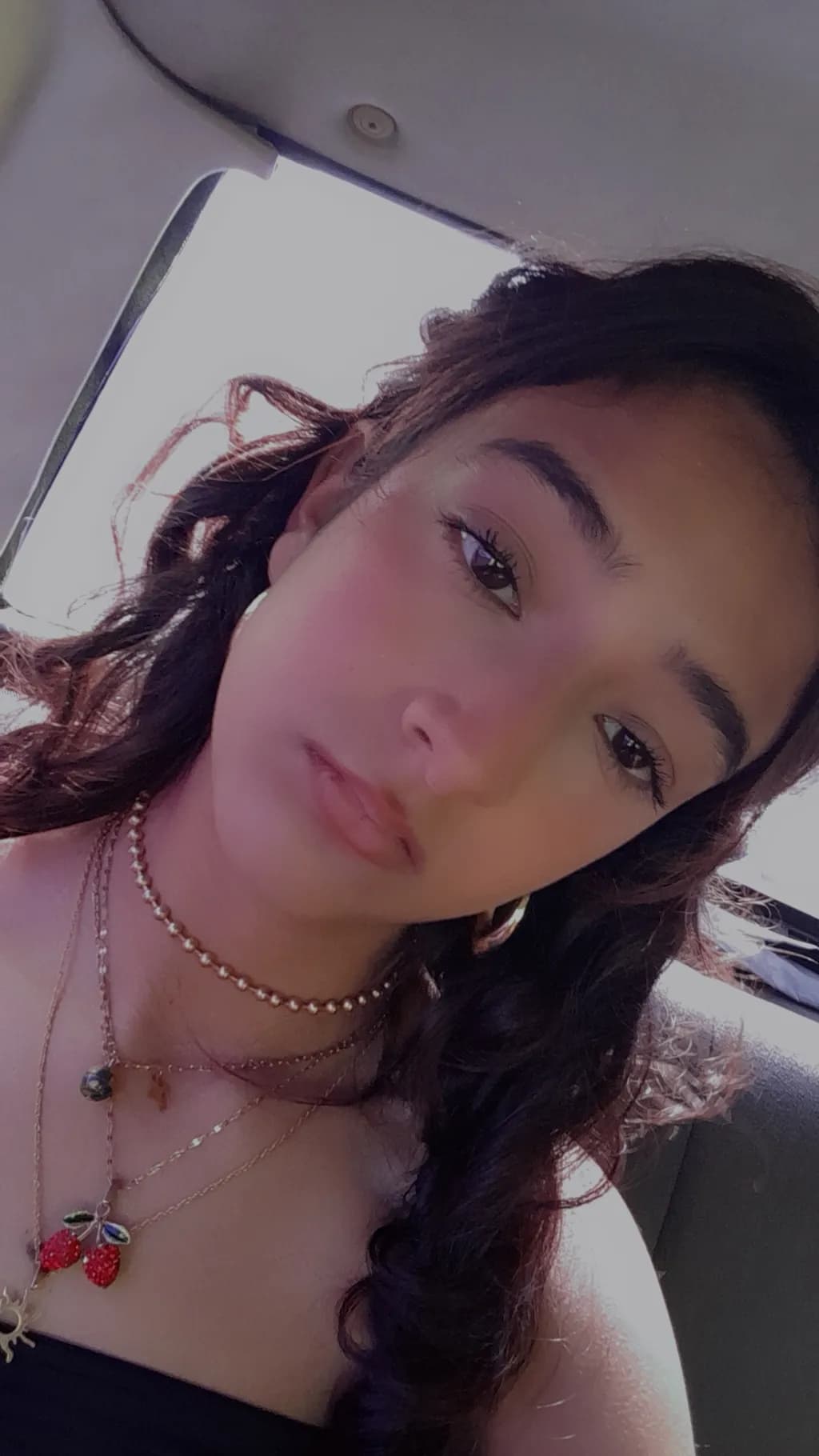 Serene Beauty: A Portrait of Casual Elegance with Curly Hair and Delicate Accessories