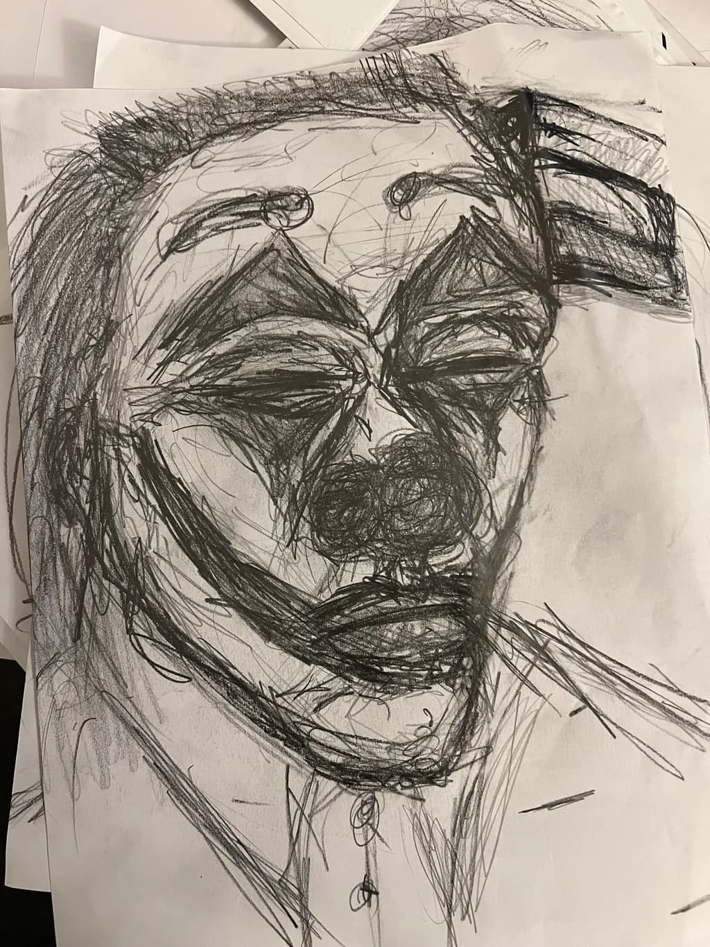 Whispers of the Jester: A Haunting Portrait in Charcoal and Emotion