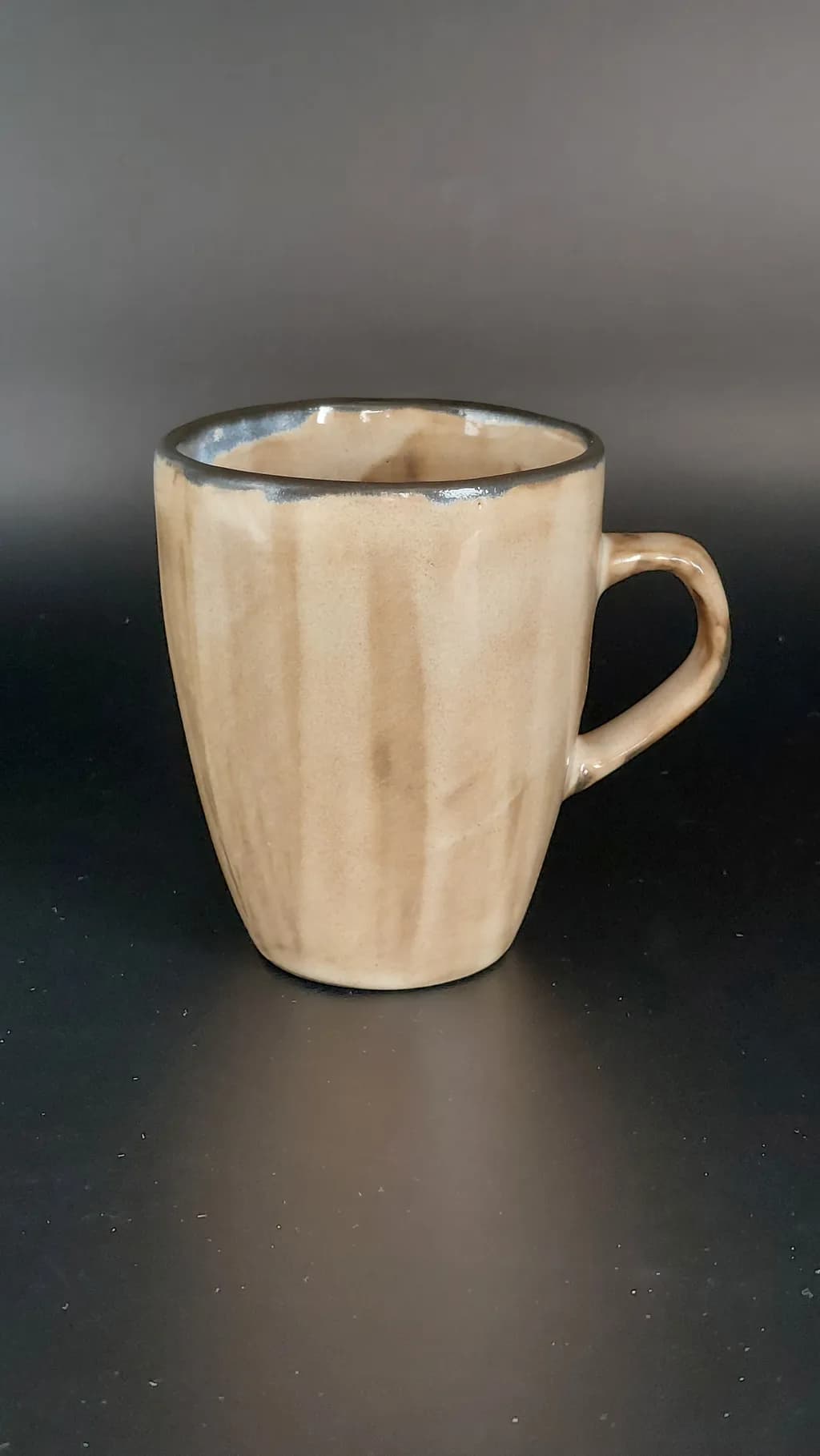 Elegant Earth Toned Ceramic Mug with Subtle Glaze Finish