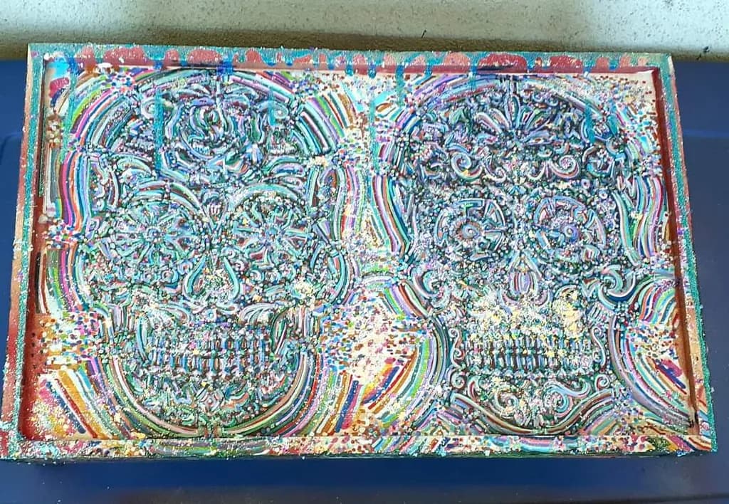 Vibrant Echoes: A Colorful Dance of Skulls in Mixed Media Art
