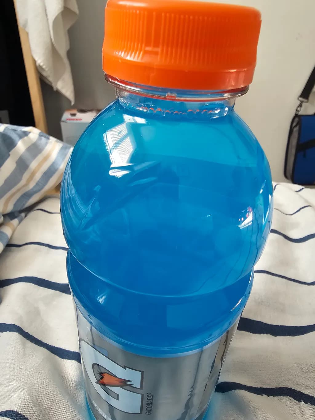 Vibrant Blue Elixir: A Refreshing Moment Captured in Time