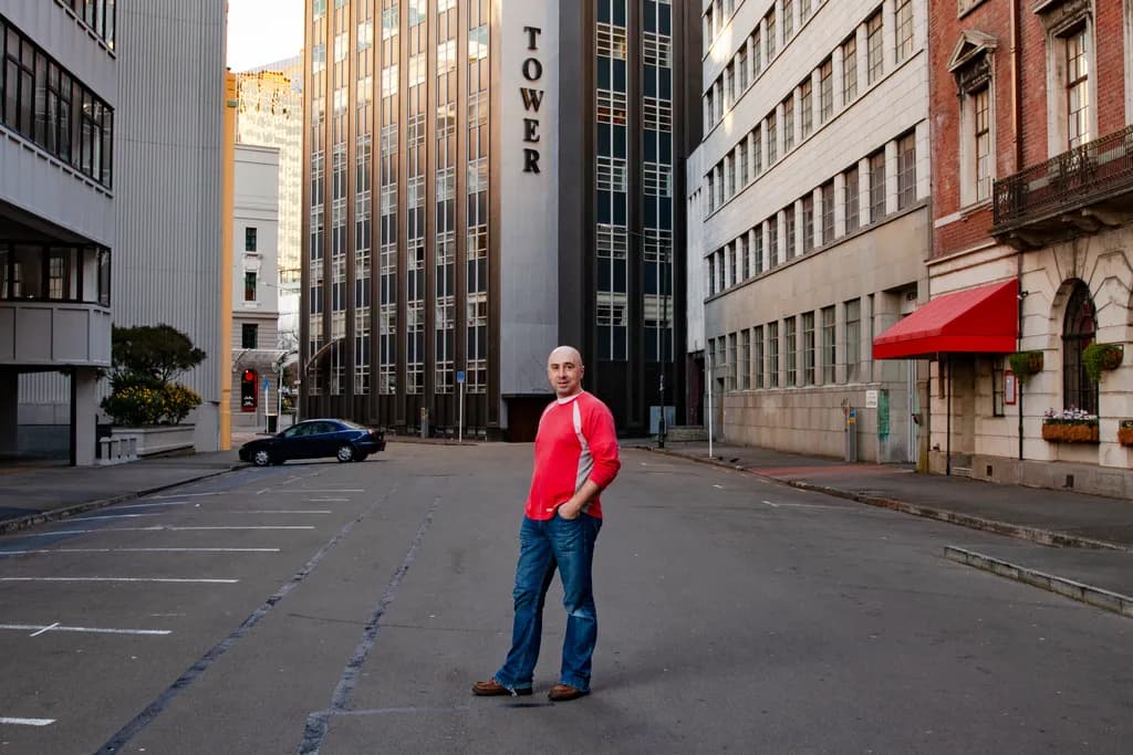 Man Among City Buildings