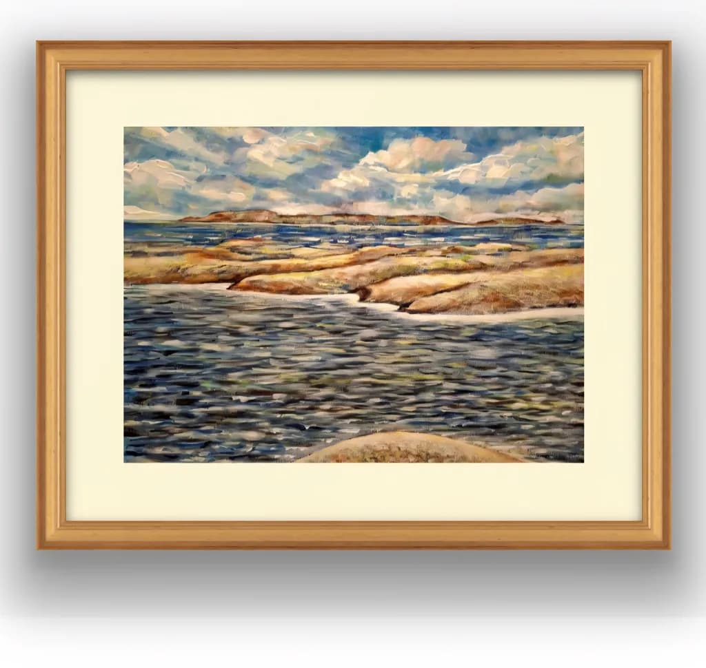 Serenity by the Water's Edge: A Tranquil Landscape of Rocks and Clouds