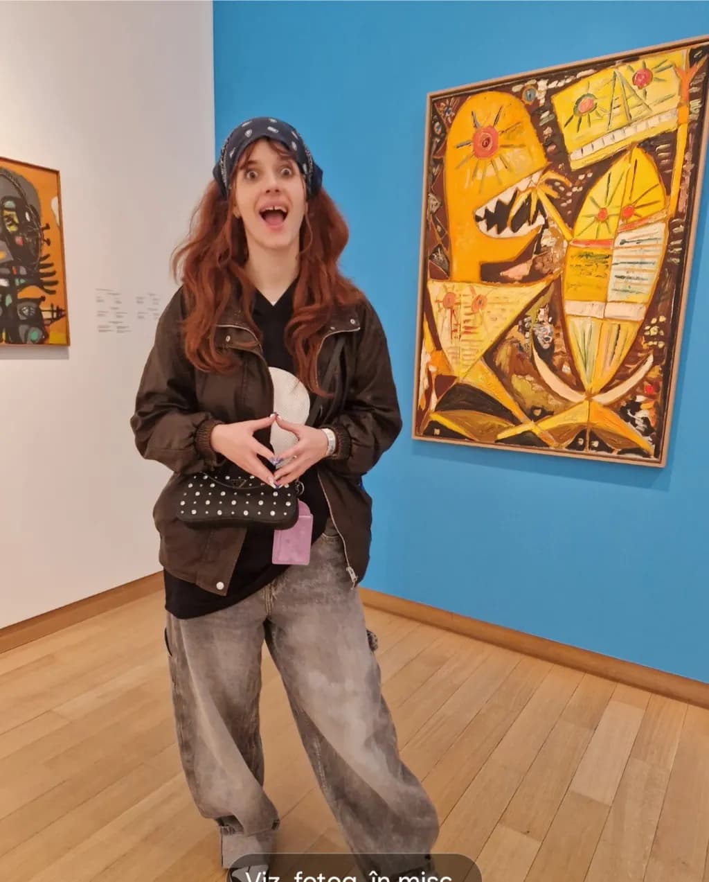 Vibrant Expressions: A Playful Encounter with Art in a Colorful Gallery Setting