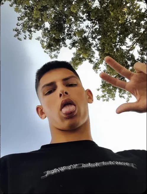 Youthful Expression: A Playful Selfie Under the Open Sky
