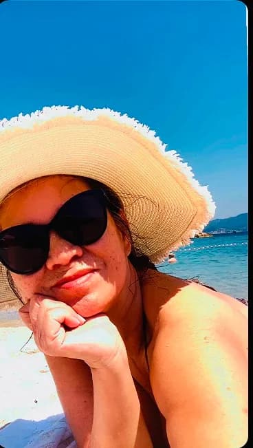 Sun-Kissed Serenity: Embracing Relaxation Under the Beach Hat