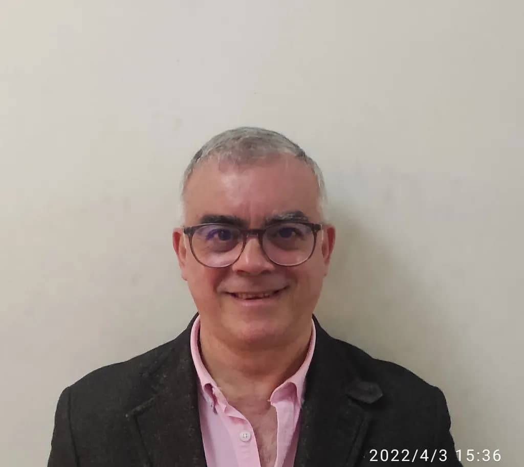 Casual Elegance: A Portrait of a Smiling Man in Glasses