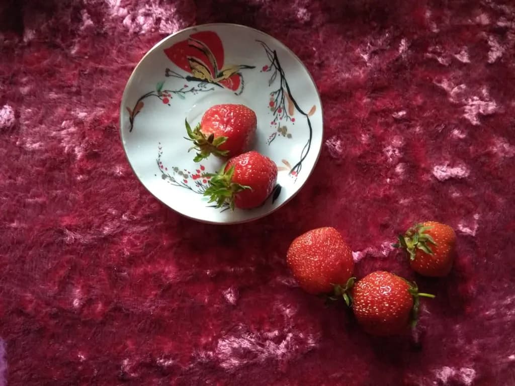 Whispers of Summer: A Delicate Dance of Strawberries on Vintage Plate