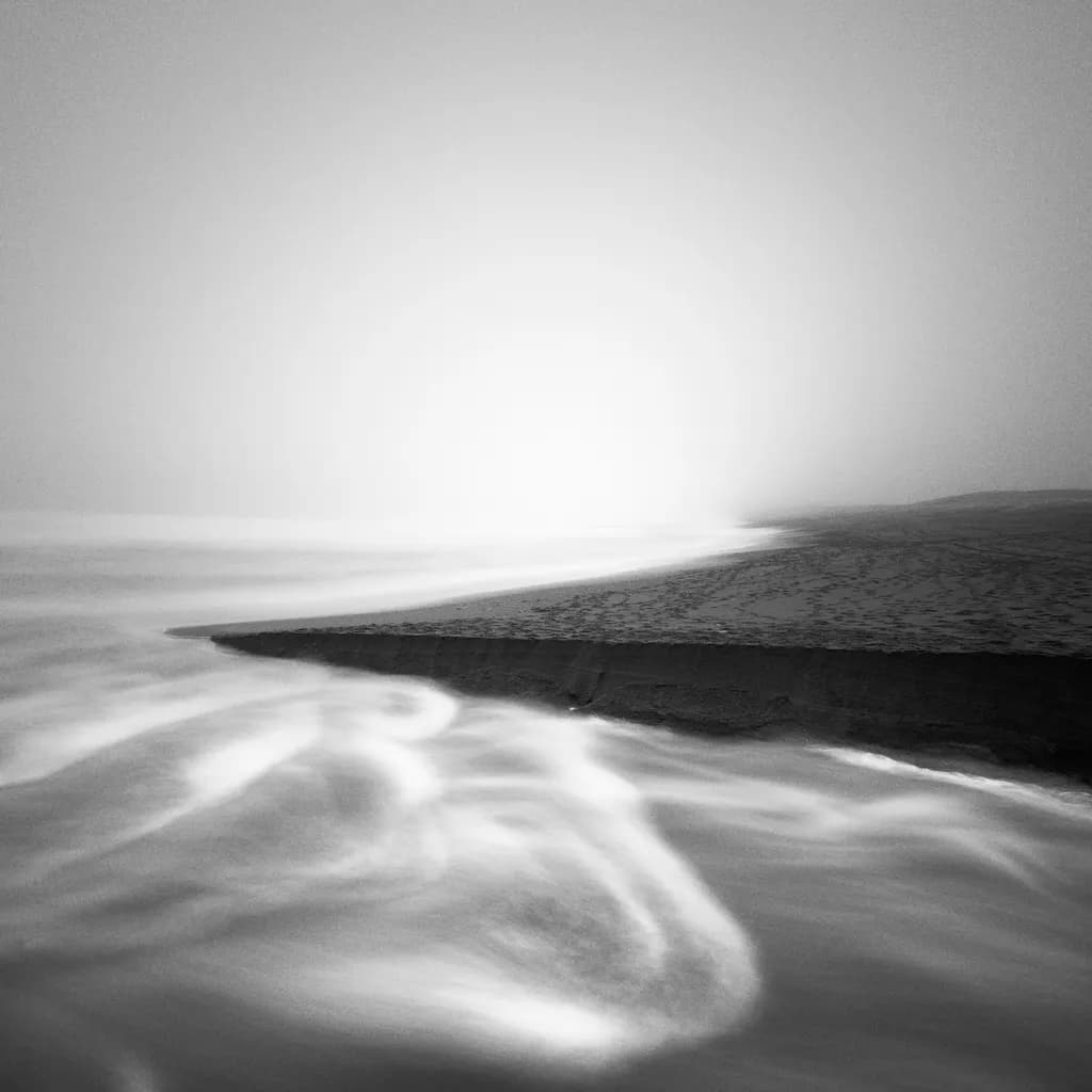 Whispers of the Tide: A Serene Dance of Light and Shadow on the Shoreline
