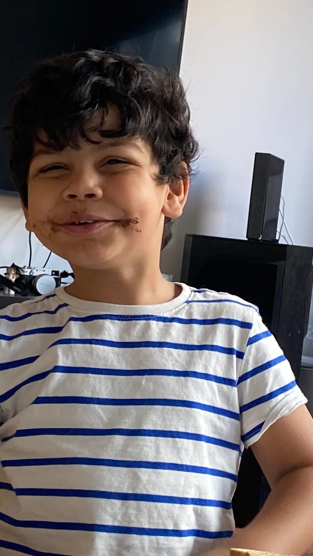 Joyful Chocolate Smiles: A Playful Moment Captured in Stripes