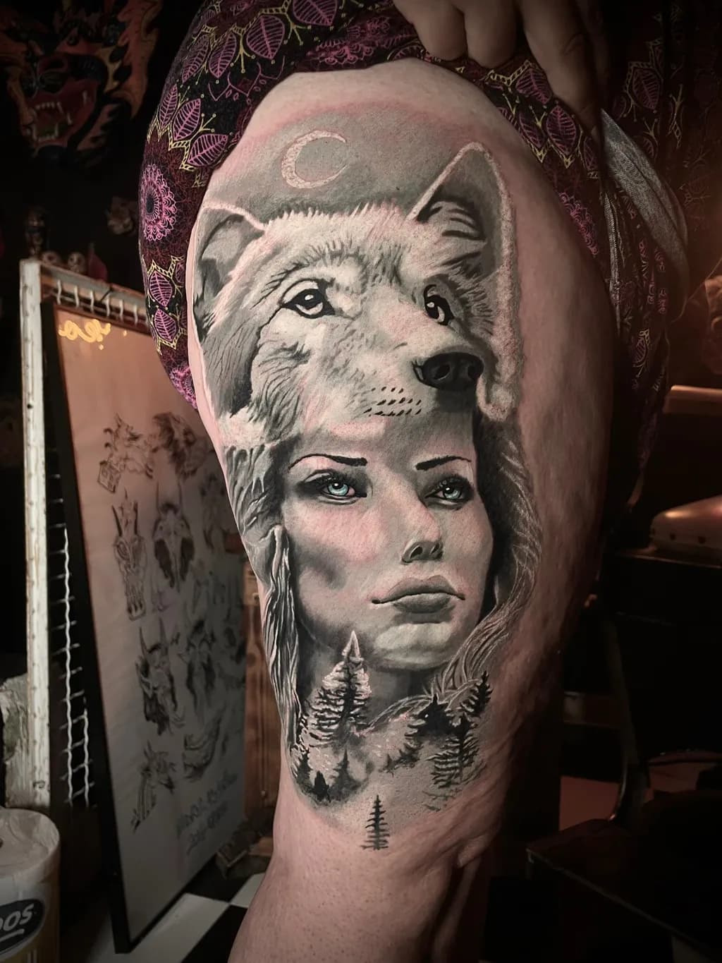 Mystical Harmony: A Wolf and Woman Tattoo Embracing Nature's Spirit